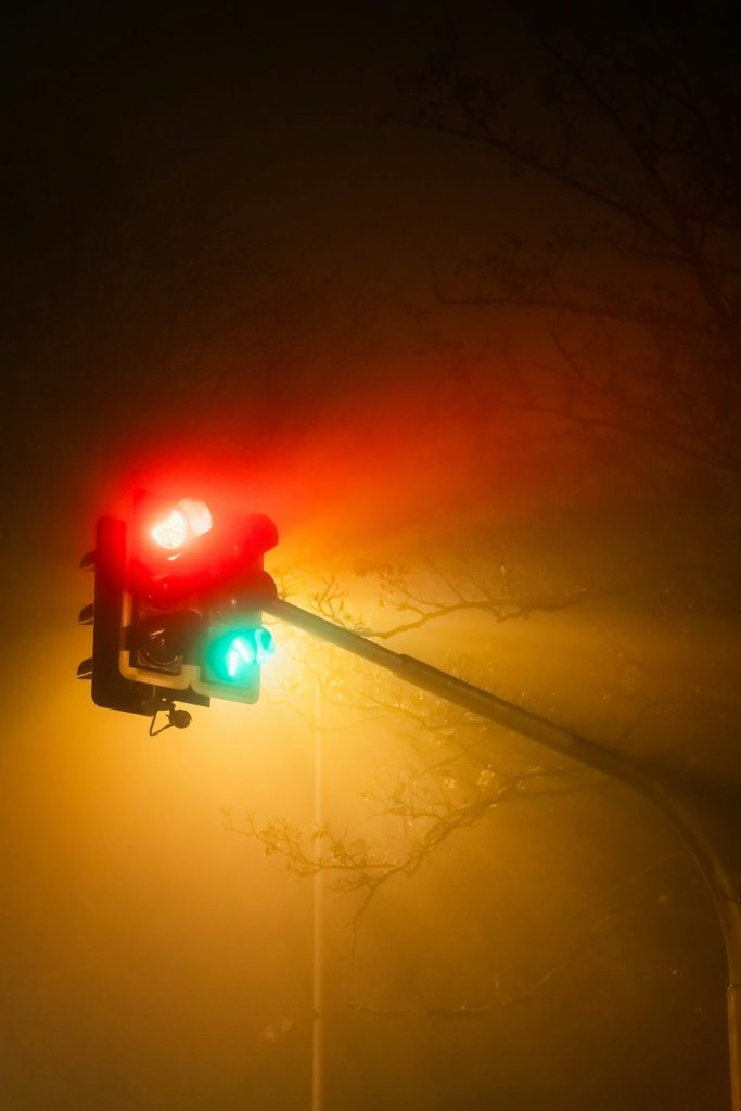 A traffic light that is red and green